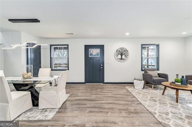 dining room with light hardwood / wood-style flooring