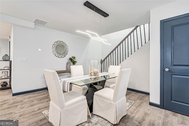 dining area with light hardwood / wood-style flooring