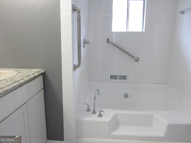 bathroom featuring vanity and a bathtub