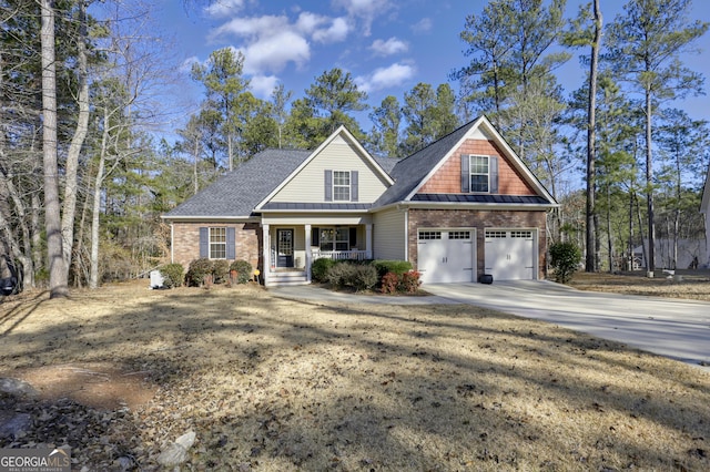 view of front of property with a porch and a garage