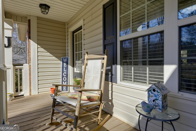 wooden terrace with a porch