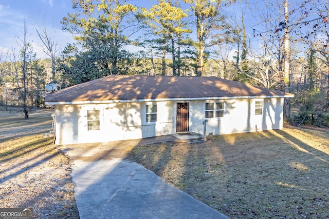 ranch-style home with a front yard