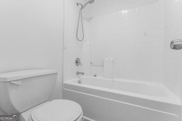 bathroom featuring toilet and tub / shower combination