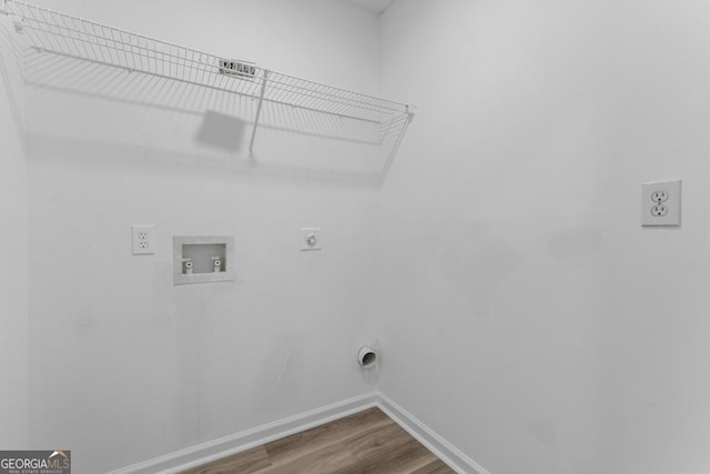 laundry area featuring wood-type flooring, washer hookup, and hookup for an electric dryer