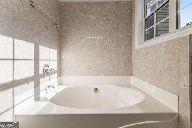 bathroom featuring a tub to relax in