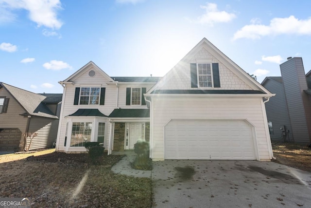 front of property with a garage