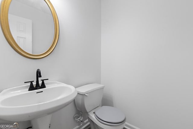 bathroom featuring sink and toilet