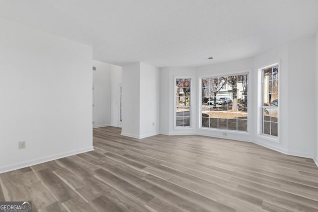 unfurnished room featuring light hardwood / wood-style flooring