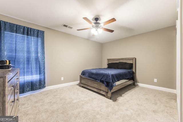 bedroom featuring light carpet, ceiling fan, visible vents, and baseboards