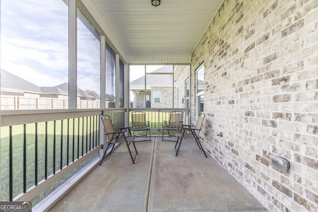 unfurnished sunroom featuring a wealth of natural light