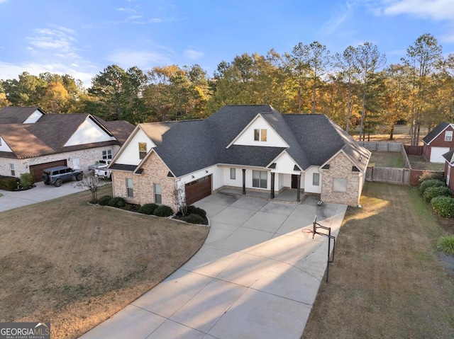 view of front facade featuring a garage and a front lawn