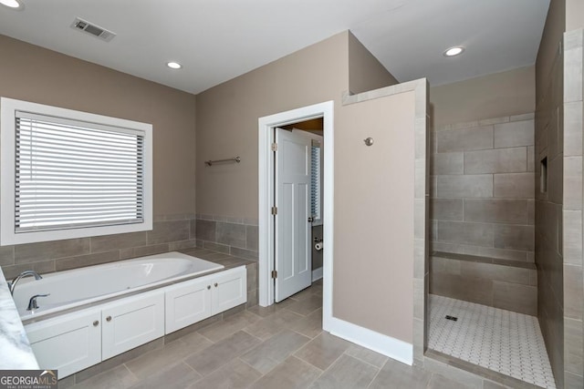 bathroom featuring separate shower and tub and tile patterned flooring