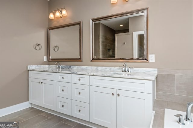 bathroom with a bath and vanity