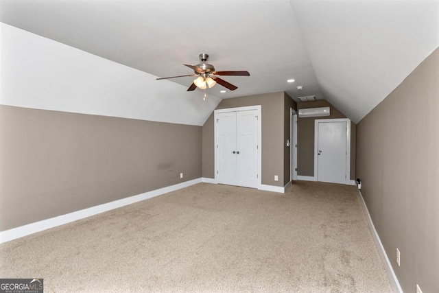 additional living space with ceiling fan, light carpet, and vaulted ceiling