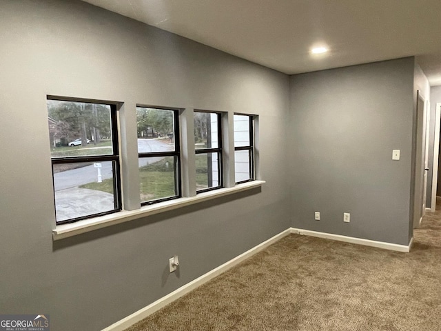 empty room with carpet flooring