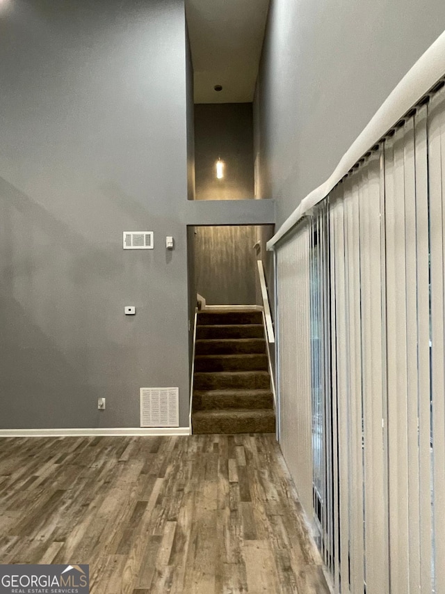 staircase with wood-type flooring