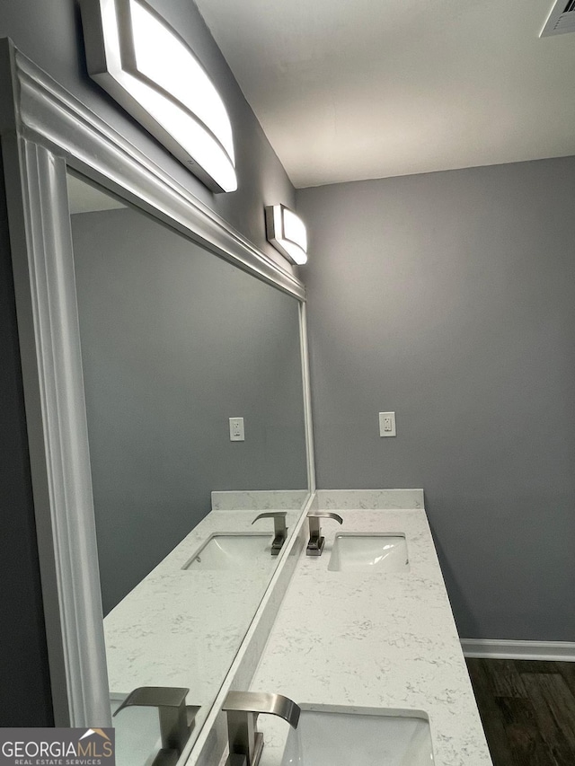 bathroom featuring wood-type flooring and vanity