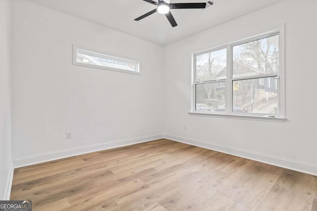 empty room featuring ceiling fan and light wood-type flooring