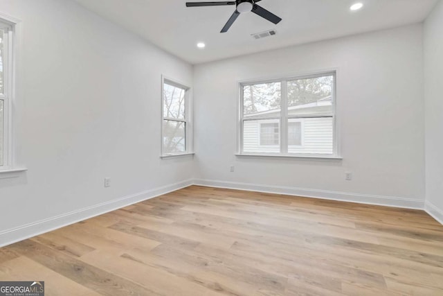 spare room with ceiling fan and light hardwood / wood-style floors