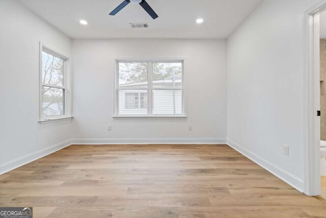 unfurnished room with ceiling fan and light hardwood / wood-style flooring