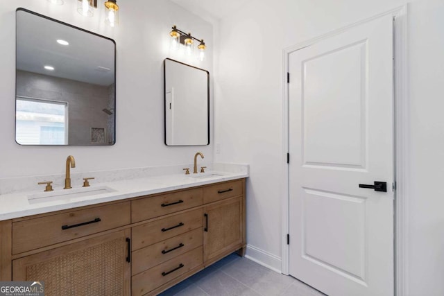 bathroom with tile patterned flooring and vanity