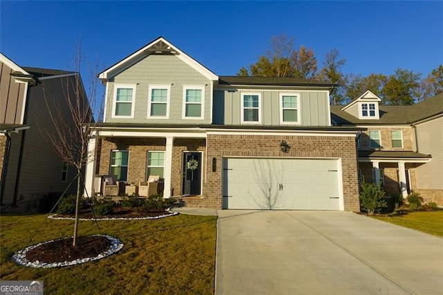 view of front of home featuring a garage and a front yard