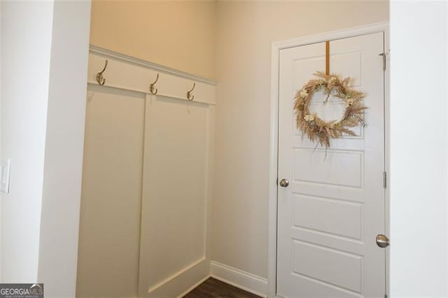 mudroom with dark wood-type flooring