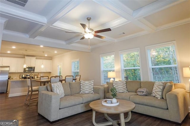 living room featuring beam ceiling, dark wood-type flooring, ceiling fan, and crown molding