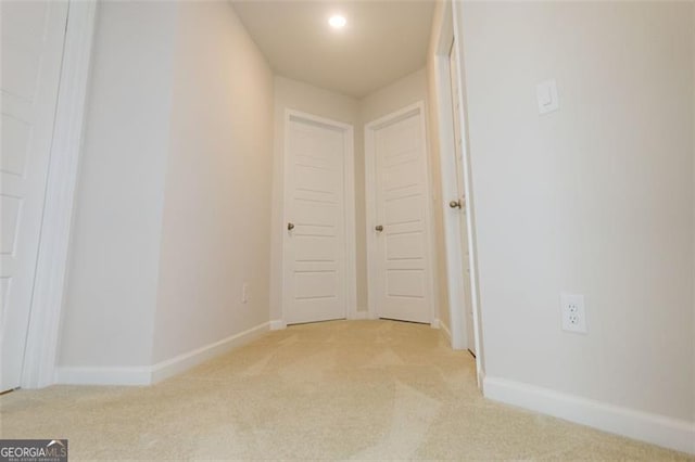 hallway with light carpet