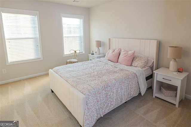 bedroom with light colored carpet