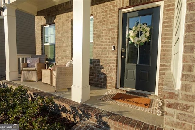 entrance to property featuring a porch