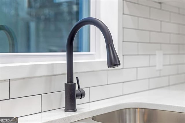 interior details with decorative backsplash and sink