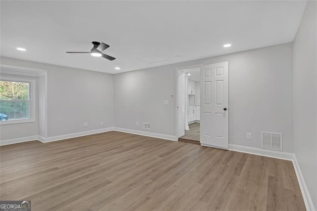 unfurnished room featuring ceiling fan and light wood-type flooring