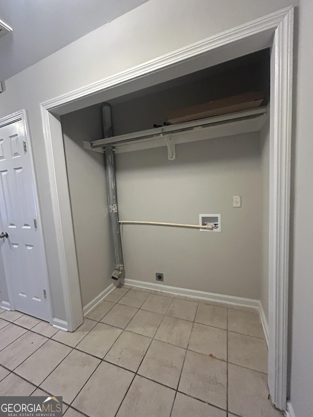 laundry area featuring light tile patterned floors, washer hookup, and hookup for an electric dryer