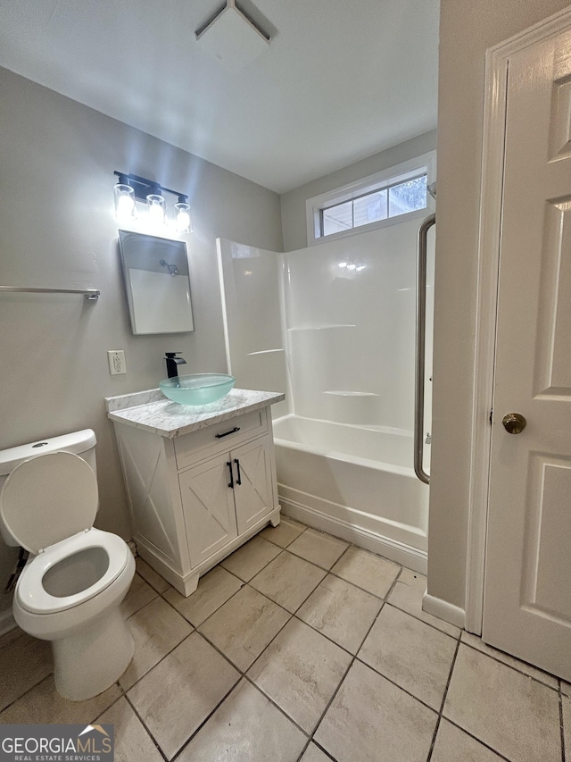 full bathroom featuring tile patterned flooring, vanity, shower / bathtub combination, and toilet