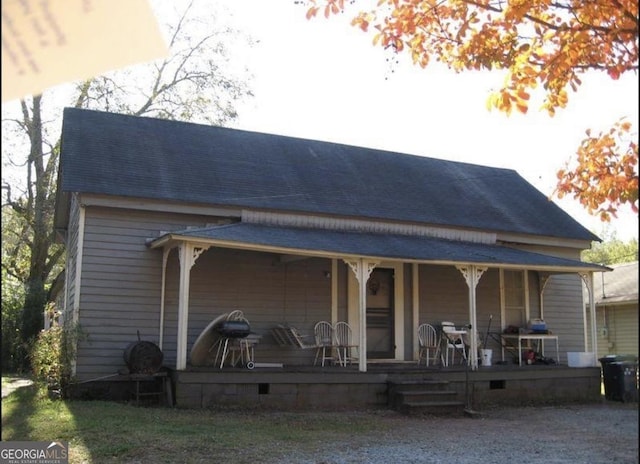 rear view of house with covered porch