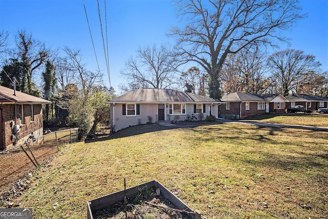 ranch-style home featuring a front yard