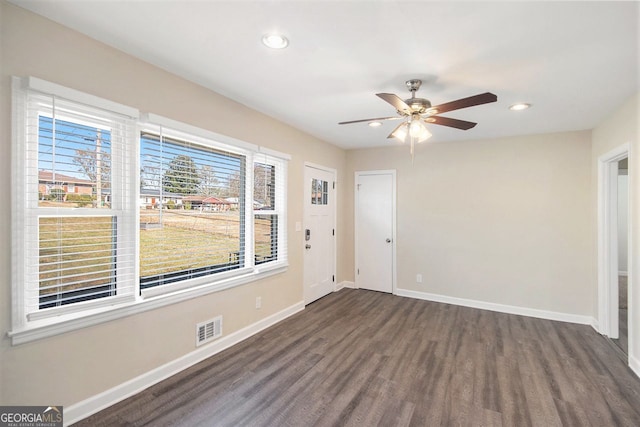 unfurnished room featuring dark hardwood / wood-style flooring and ceiling fan