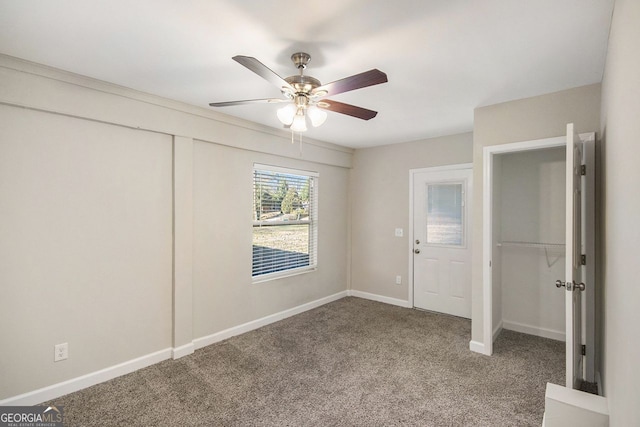 unfurnished bedroom with carpet flooring and ceiling fan