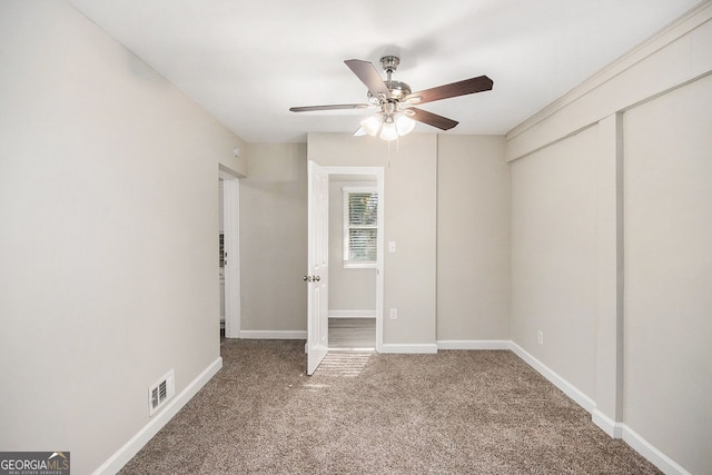 unfurnished bedroom with carpet, a closet, and ceiling fan