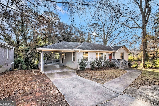 ranch-style home with a carport