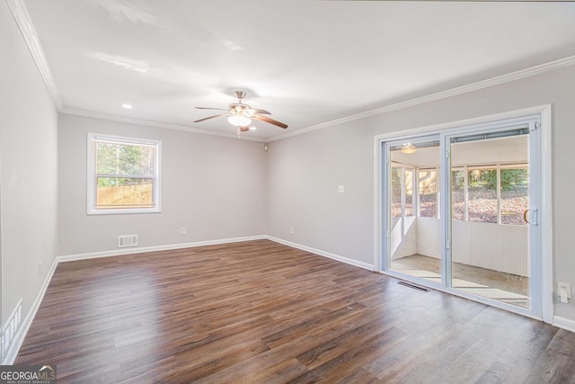 empty room with dark hardwood / wood-style flooring, ceiling fan, and ornamental molding