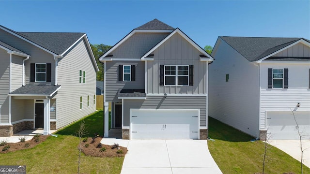 view of front of house with a garage and a front lawn