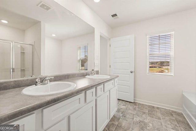 bathroom featuring vanity and plus walk in shower