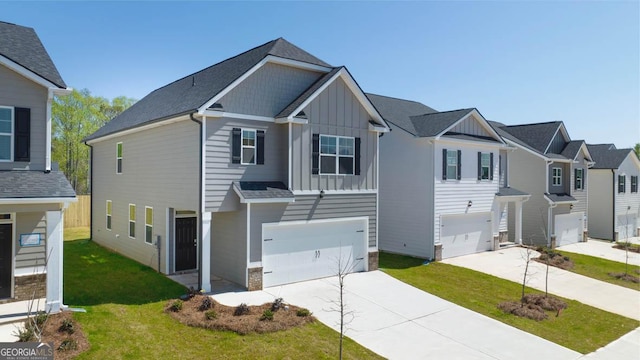 view of front of house with a garage and a front lawn