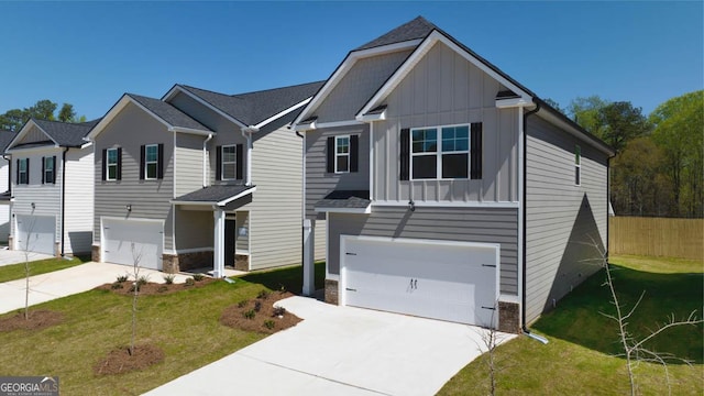 view of front of house with a garage and a front lawn