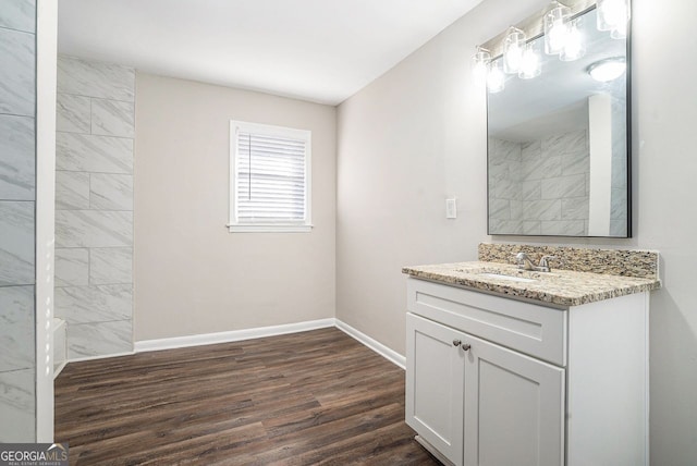 bathroom with hardwood / wood-style floors and vanity