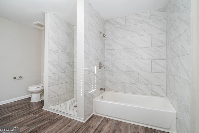 bathroom with toilet and hardwood / wood-style flooring