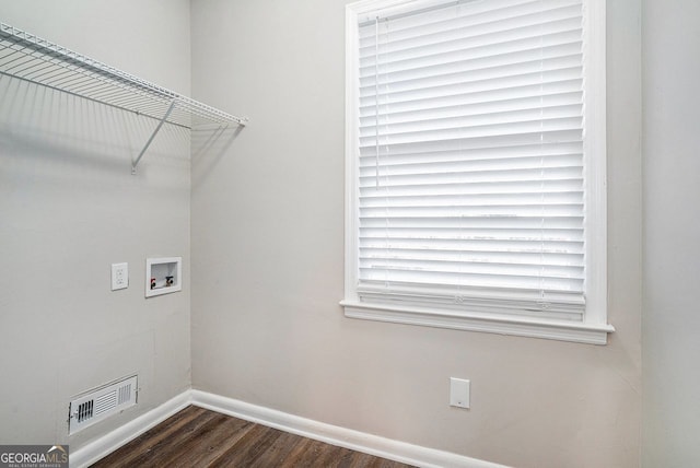 laundry area featuring hookup for a washing machine and dark hardwood / wood-style flooring