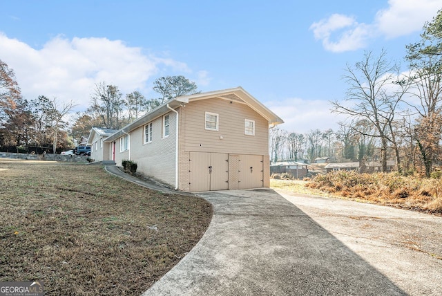 view of side of home with a garage